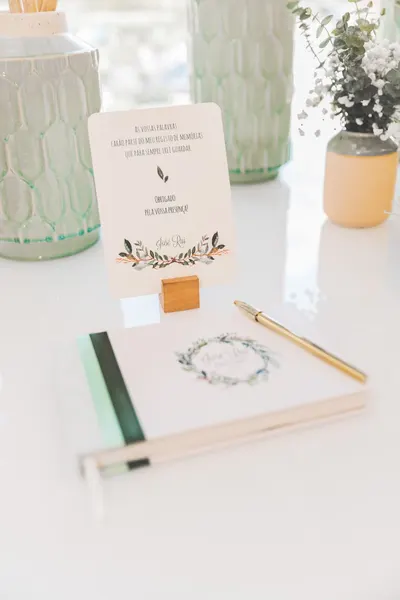 Creative writing setup featuring elegant floral stationery and decor in a bright setting.