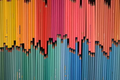 A vibrant array of colored pencils neatly arranged in a gradient. Perfect for creative and educational themes.