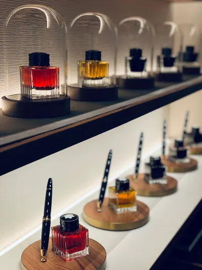 Showcase of vibrant ink bottles on a stylish shelf, perfect for adding color.