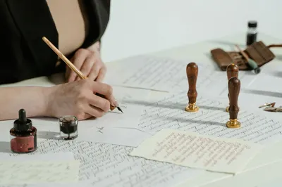 Artistic calligraphy writing with vintage seals and ink on paper.
